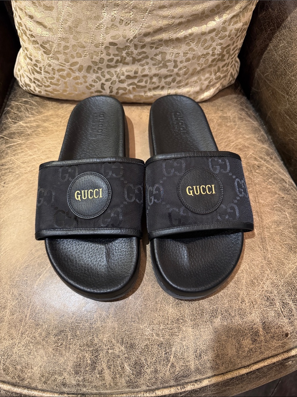 Authentic Gucci Black Slides with Gold Logo Medallion